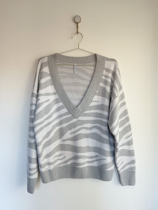 front of varley calvert v-neck zebra striped grey and white sweater