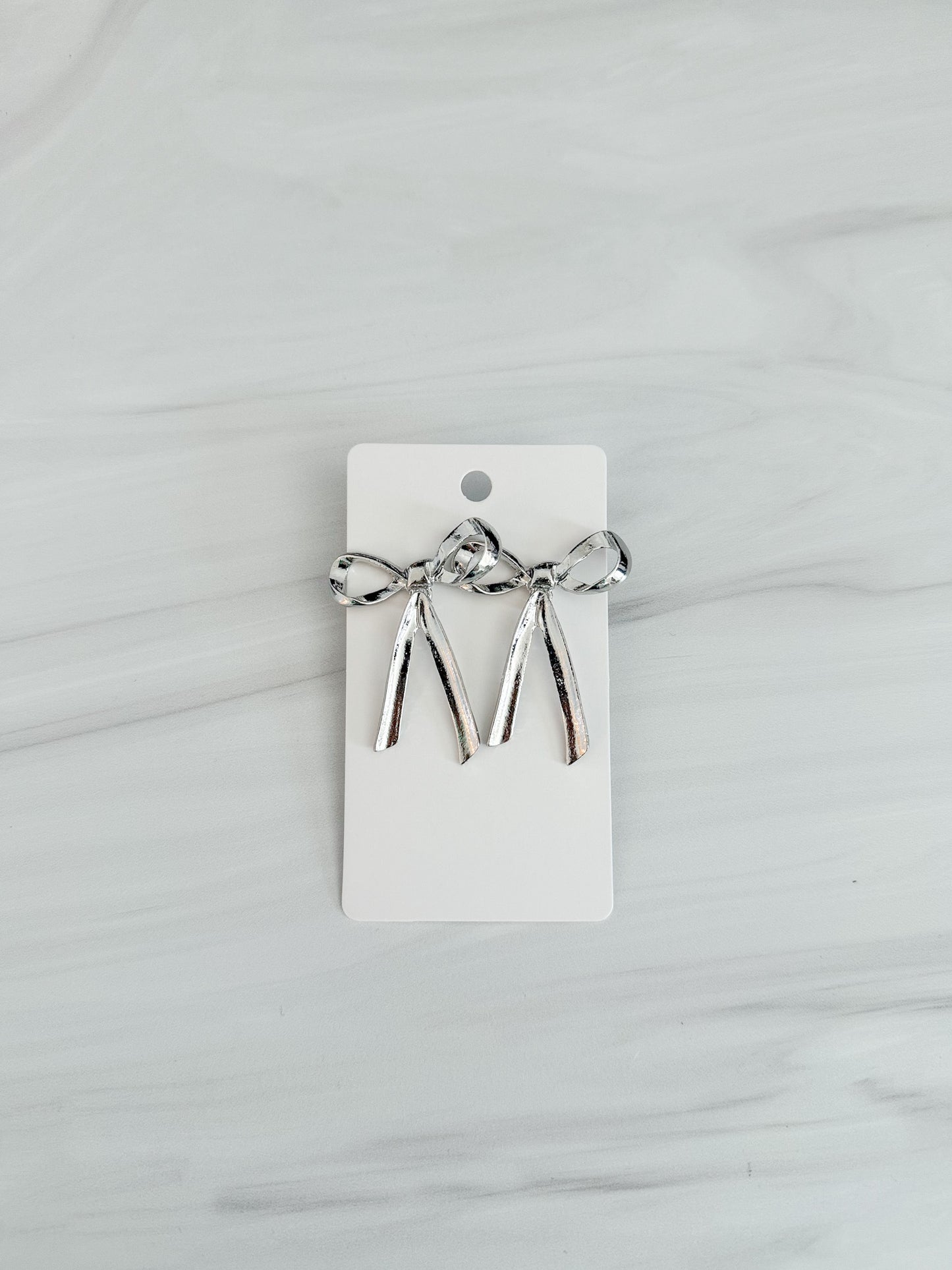 Bow Stud Earrings in Gold and Silver