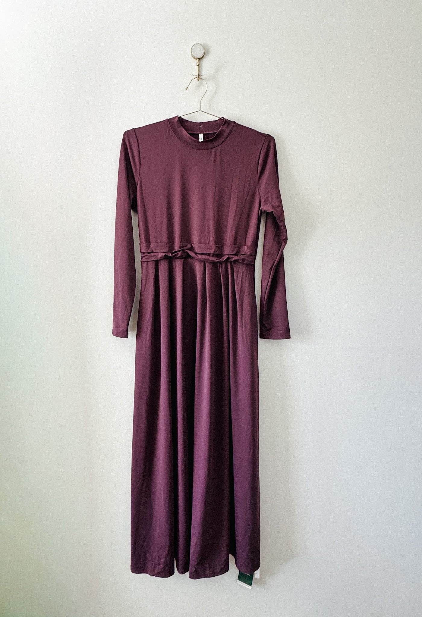 Purple Halara maxi dress on a hanger against a white background