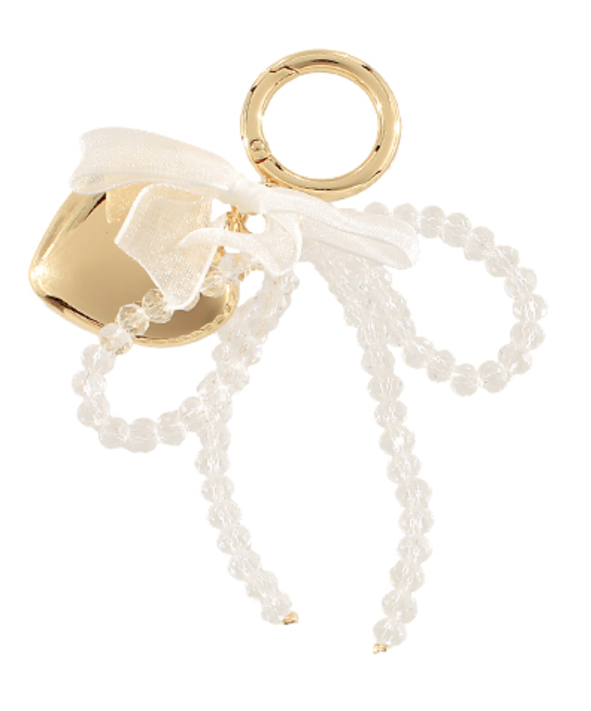 Gold and white beaded keychain on a white background