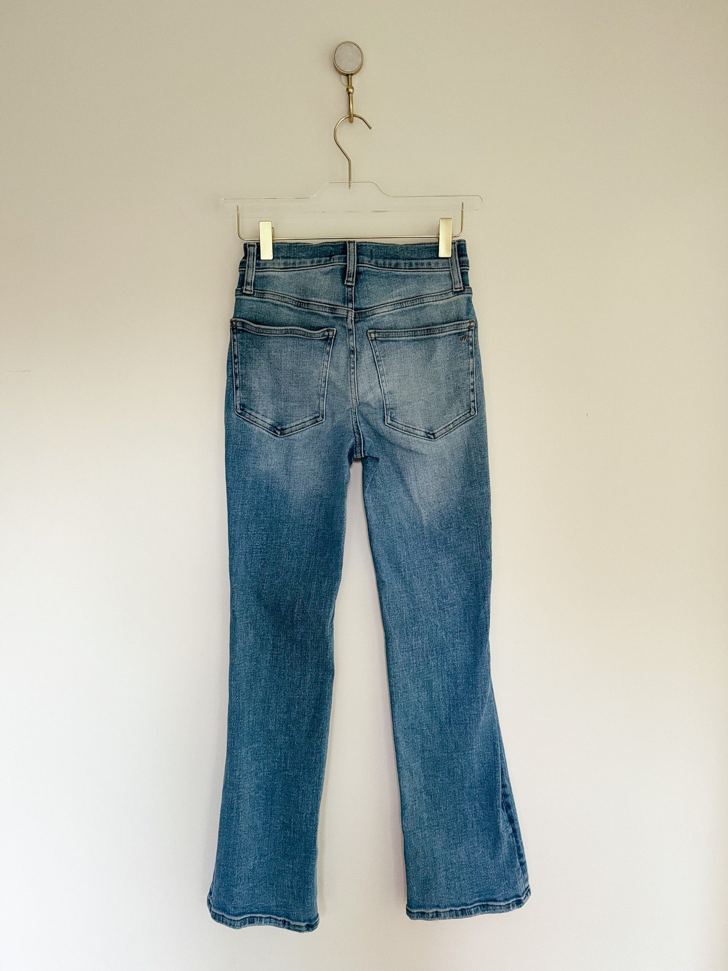 Back of Madewell Mid Rise Kick Out Crop Jeans