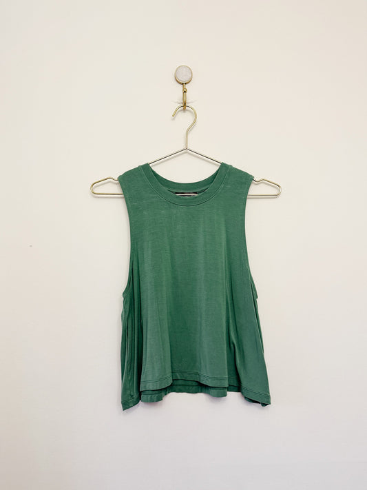 Carbon38 Crop Tank 2.0 tank top on a hanger against a white background