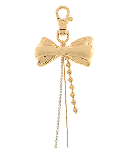 Gold bow-shaped keychain with chain on a white background
