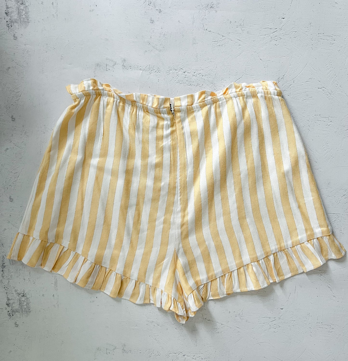 back of lovers and friends yellow and white striped shorts